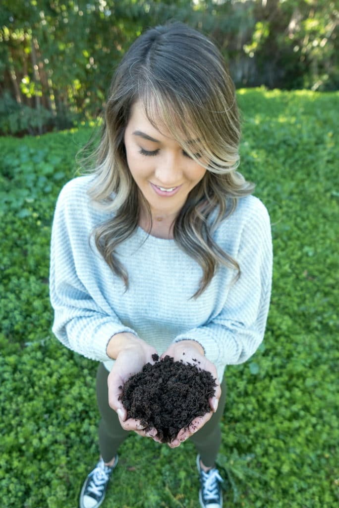 Woman holding compost